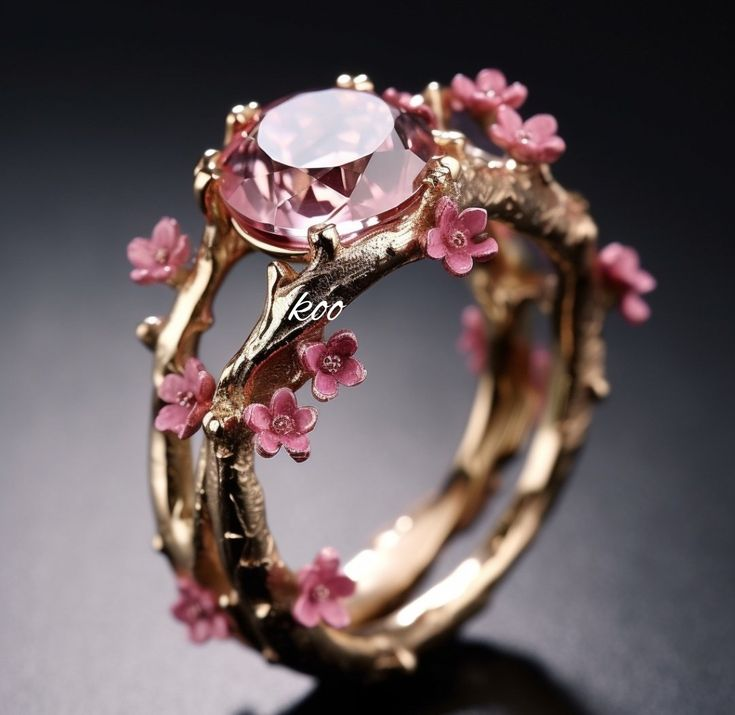 Gold Ring Adorned with Pink Crystal and Delicate Floral Accents